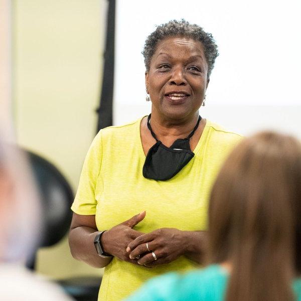 Faye Richardson-Green speaks with students during her honors seminar class.